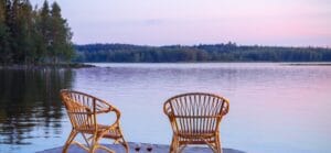 Two empty chairs on a dock, inviting deep conversations